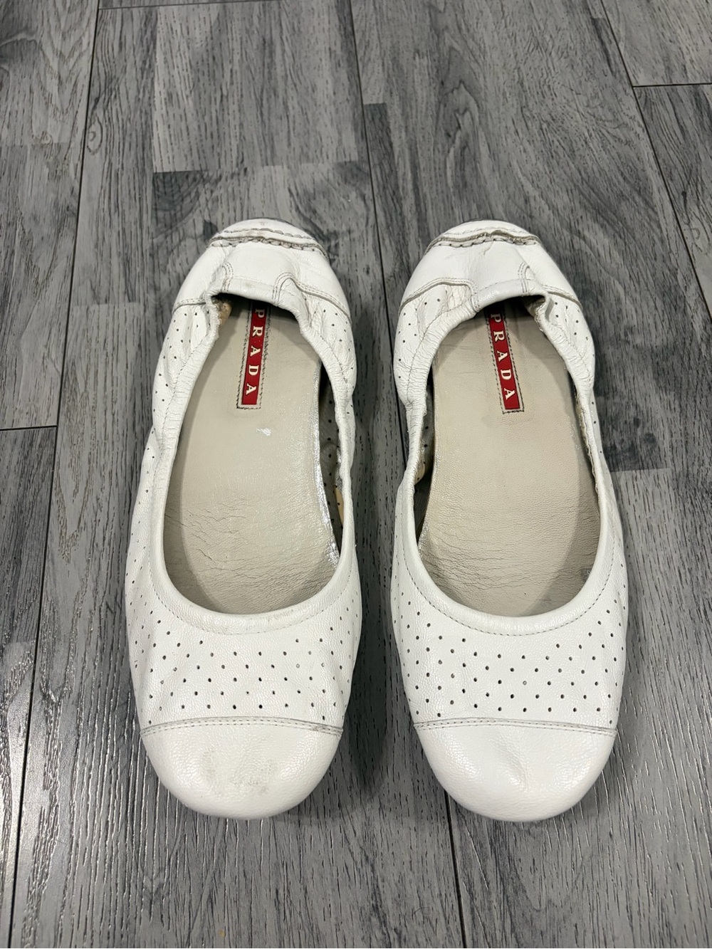 Prada Linea Rossa White Perforated Leather Ballet Flats